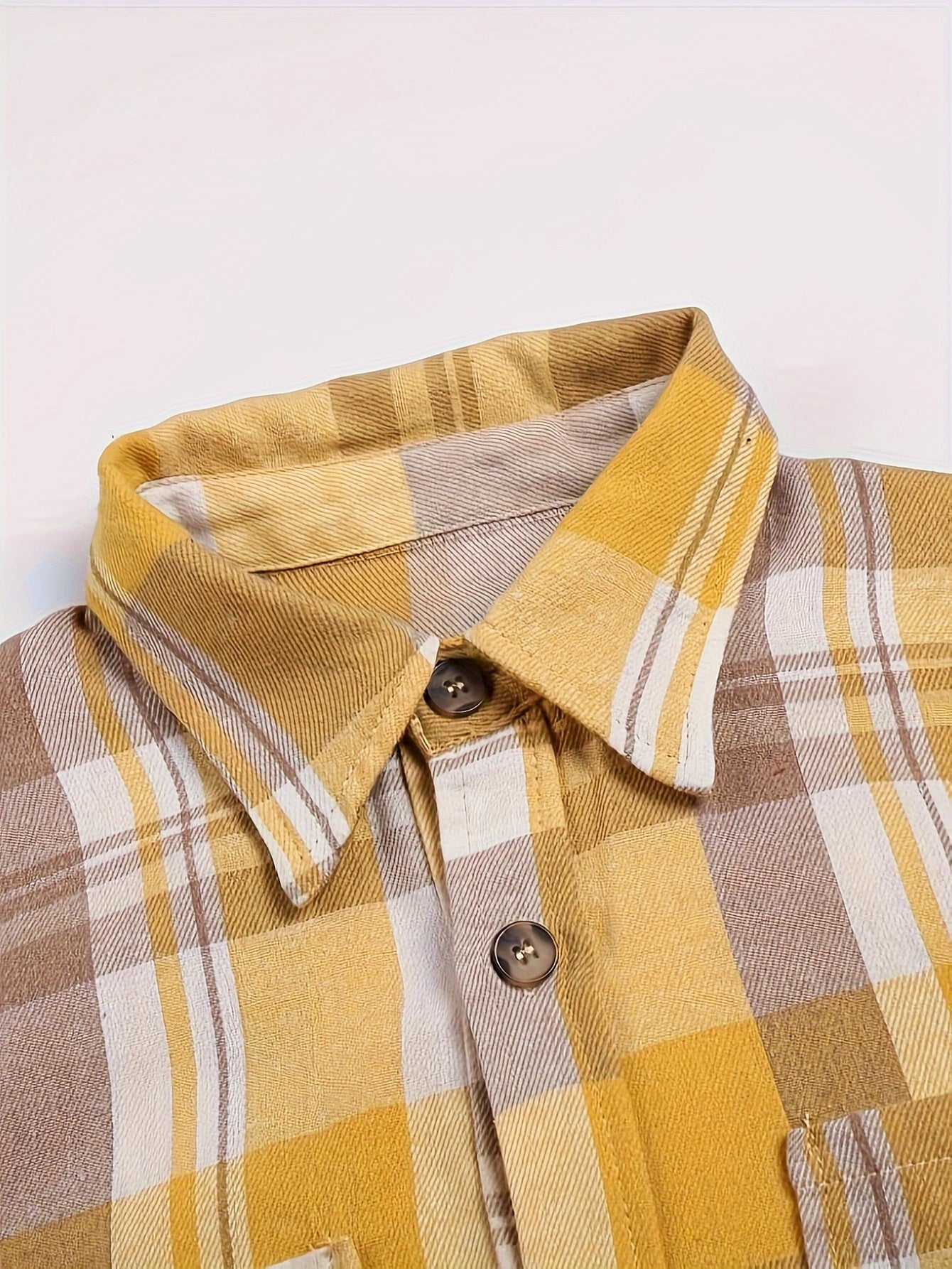 Yellow plaid long-sleeve button-up shirt with pointed collar and button front