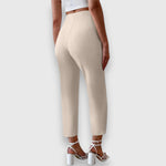 Beige high-waisted trousers, straight tailored leg, ankle length, side view