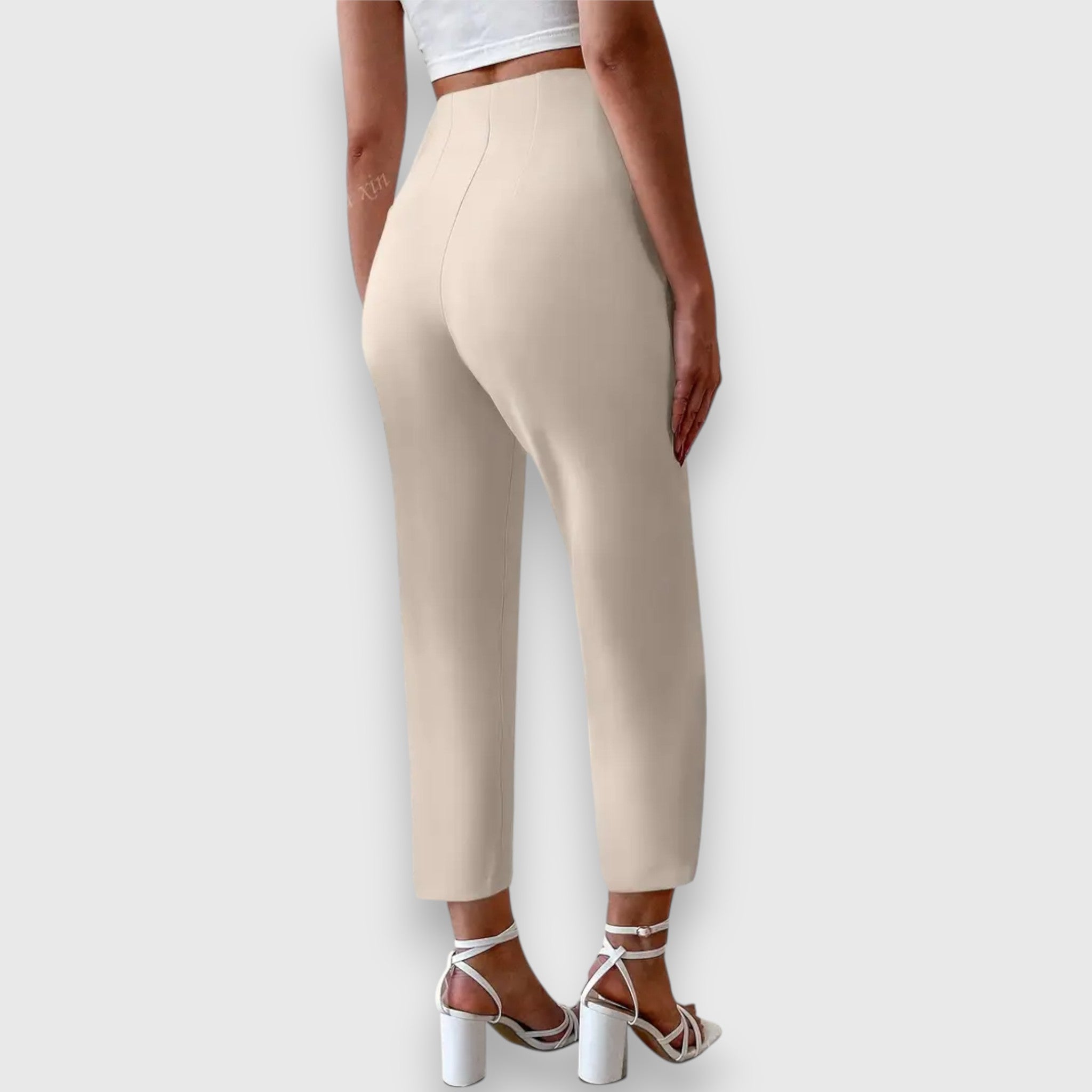 Beige high-waisted trousers, straight tailored leg, ankle length, side view