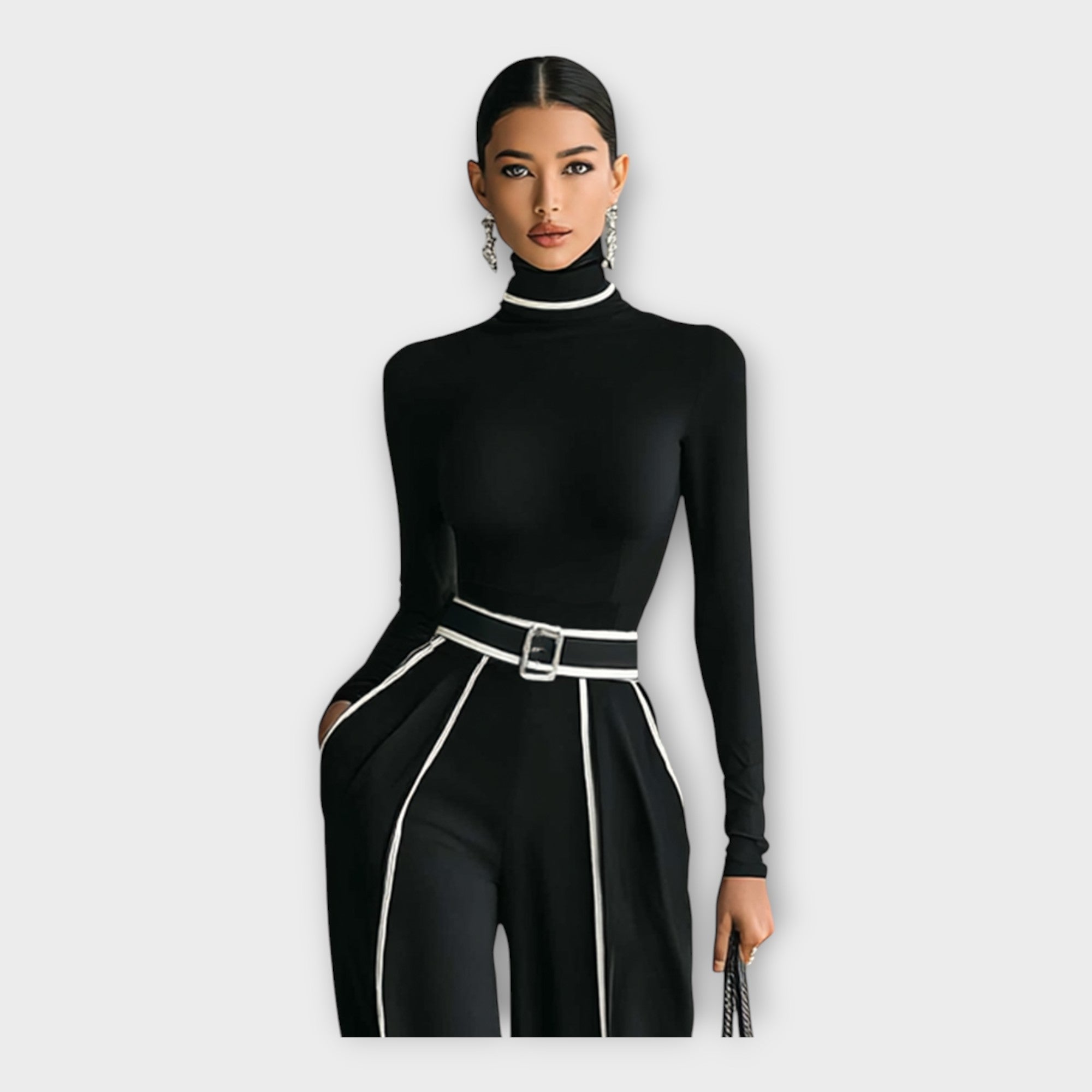 Women's black turtleneck jumpsuit with contrast trim and belted waist, close-up front