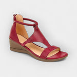 Red leather-look comfort sandals with open toe, cross straps, and wedge sole