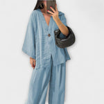 Light blue layered V-neck top and wide-leg pants set