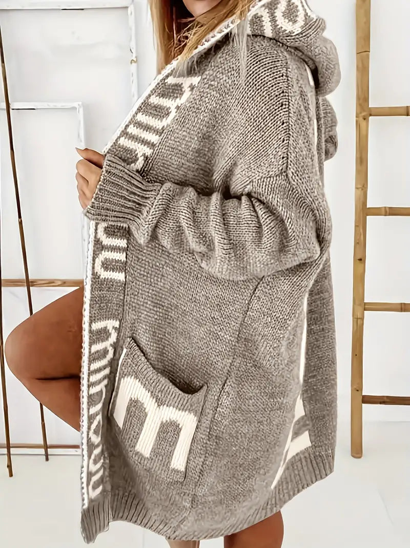 Beige-brown hooded knit cardigan with white geometric trim and front pockets, long sleeves