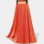 Long pleated satin skirt, orange with elastic waistband and smooth pleated A-line shape.