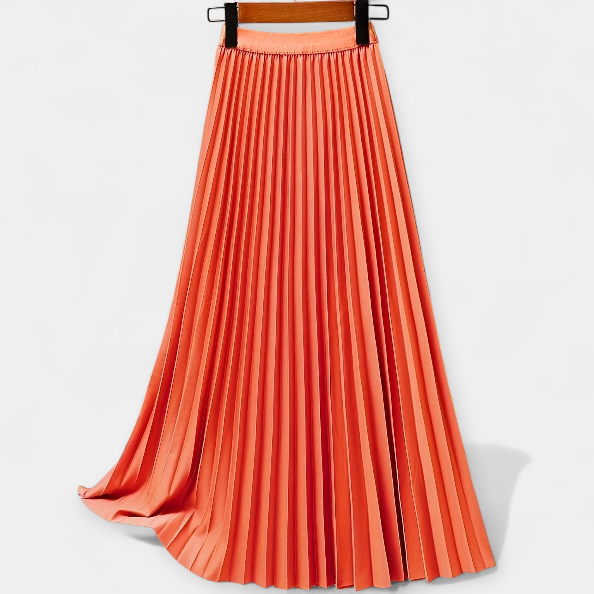 Long pleated satin skirt, orange with elastic waistband and smooth pleated A-line shape.