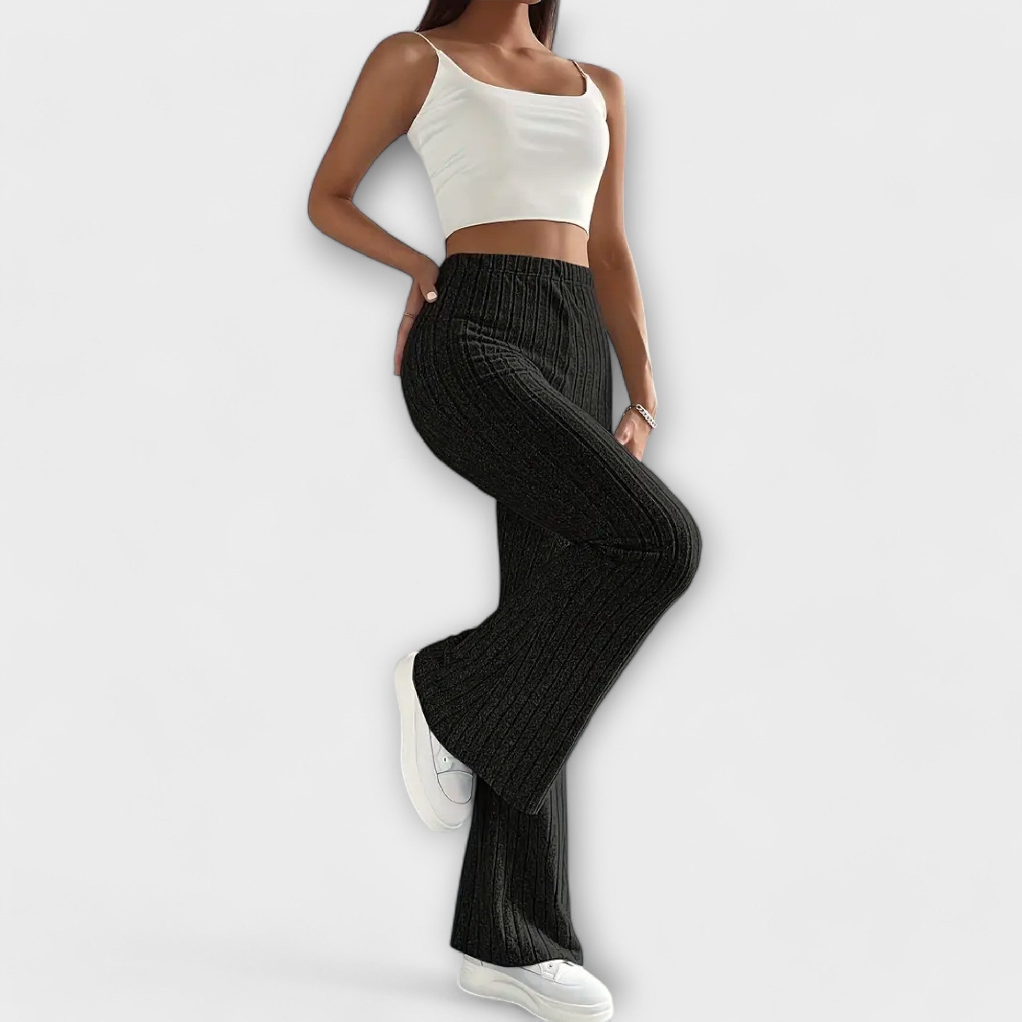 Black ribbed knit high-waist flare pants, fitted hips with wide bell-leg