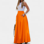 Orange midi skirt with pleated A-line design and wide waistband