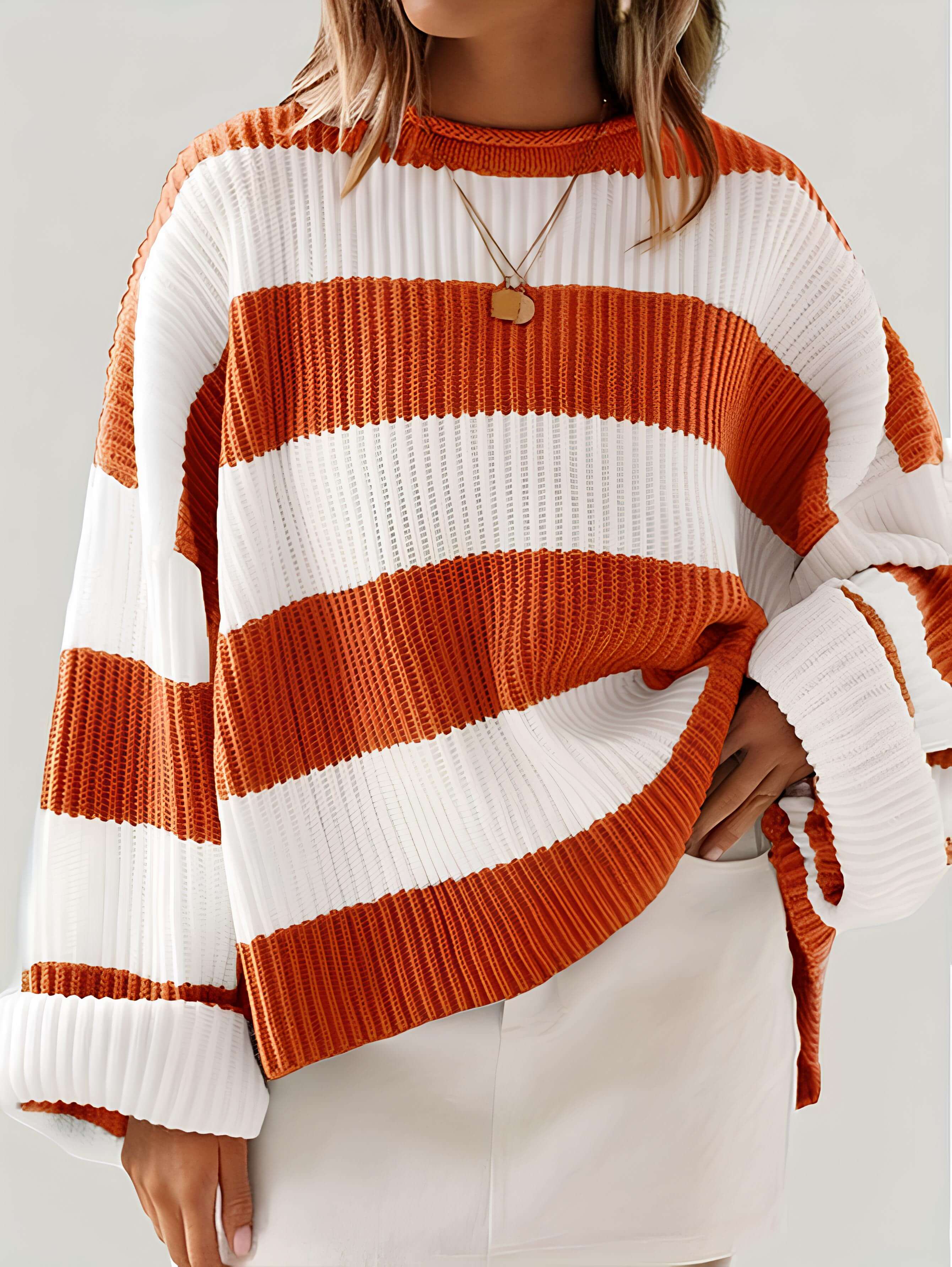 Women’s winter striped knit sweater in white and orange, crew neck, ribbed cuffs