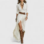 White long linen wrap dress with V-neck, three-quarter sleeves, and flowing skirt