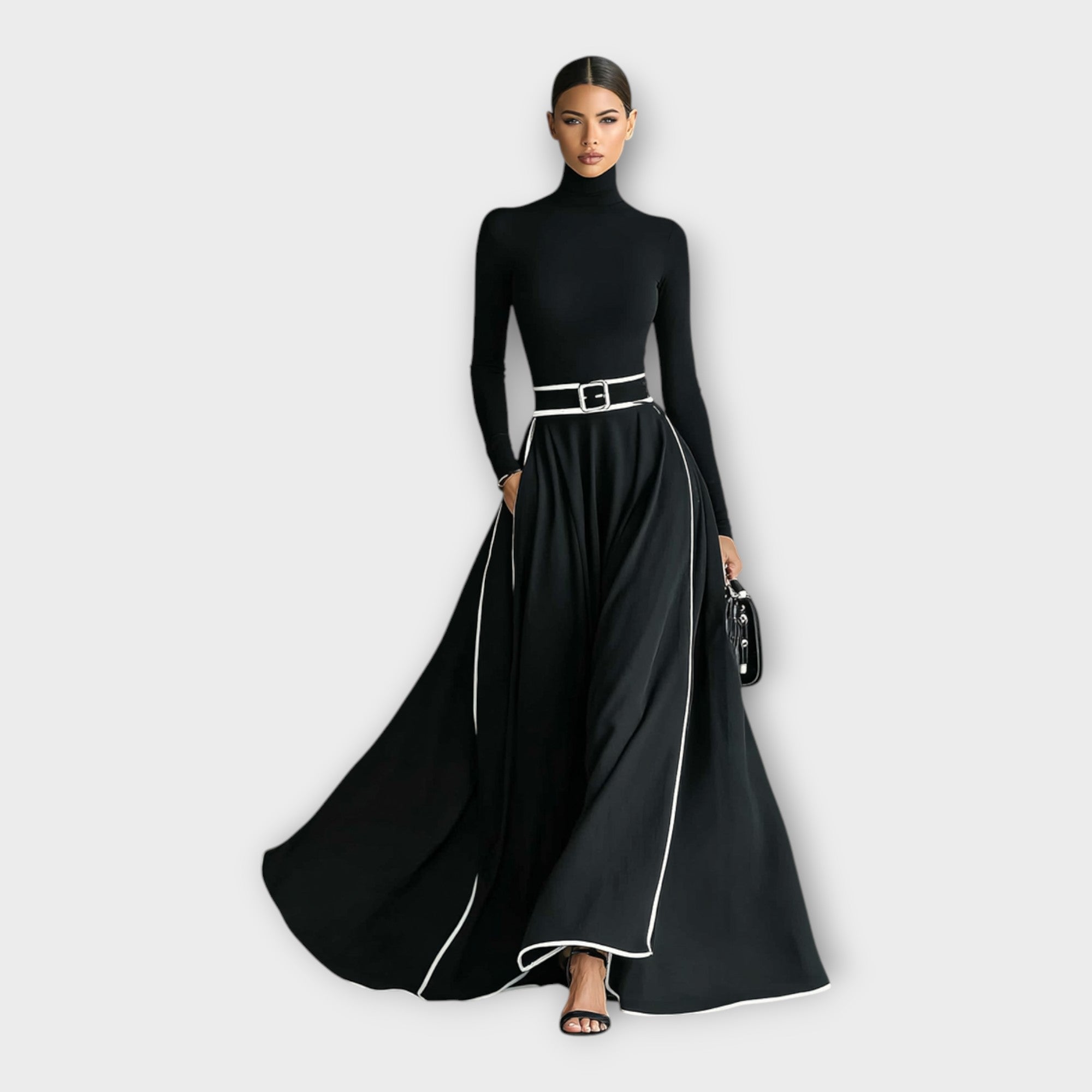Black long-sleeve maxi dress with high neck, silver-buckle belt, contrast piping hem