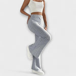 Grey ribbed knit flared pants with high waist and tapered-to-bell shape
