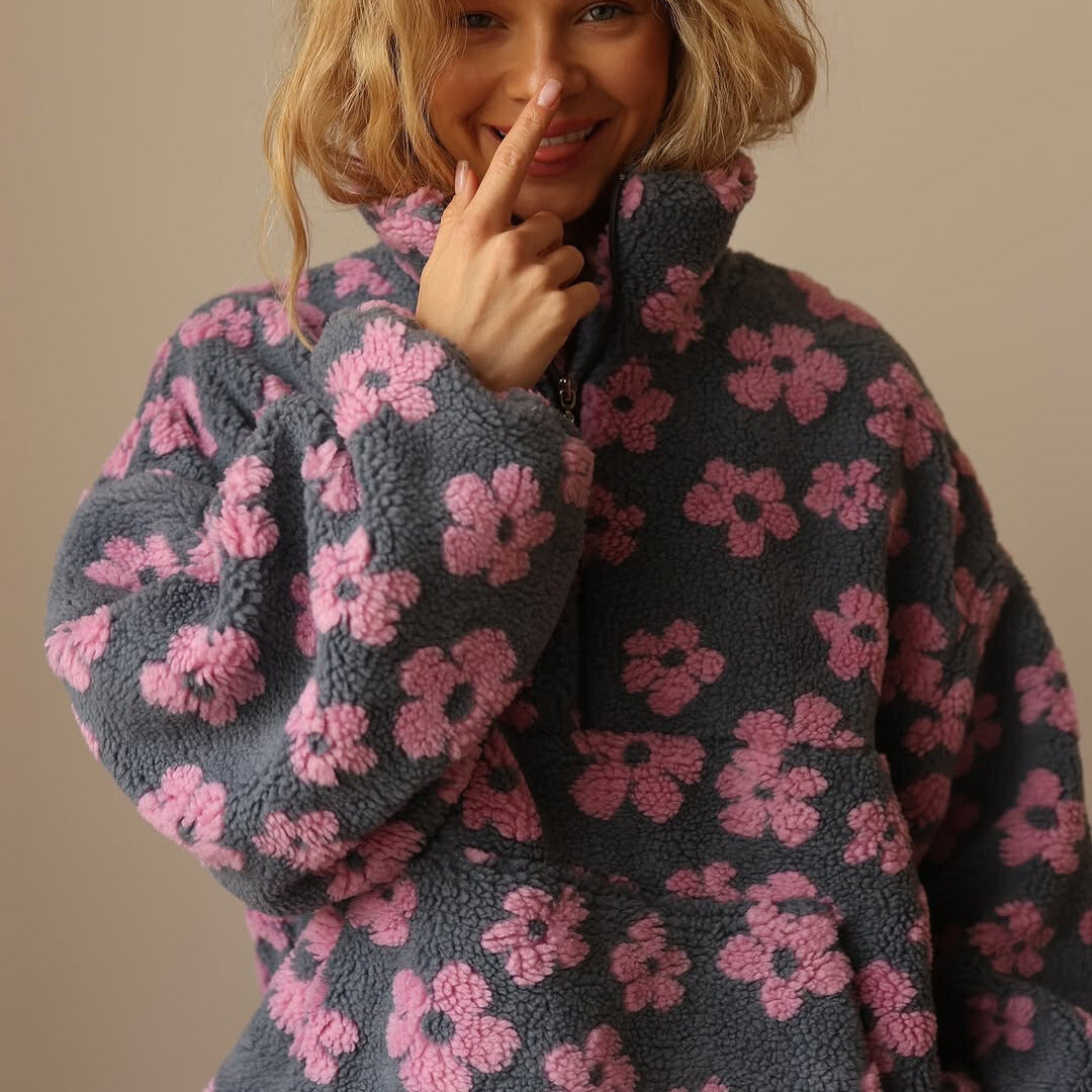 Black fuzzy fleece half-zip hoodie with pink flower pattern, long sleeves and hood