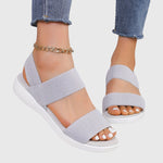 Light gray orthopedic sandals with two wide straps, open toe, white cushioned sole