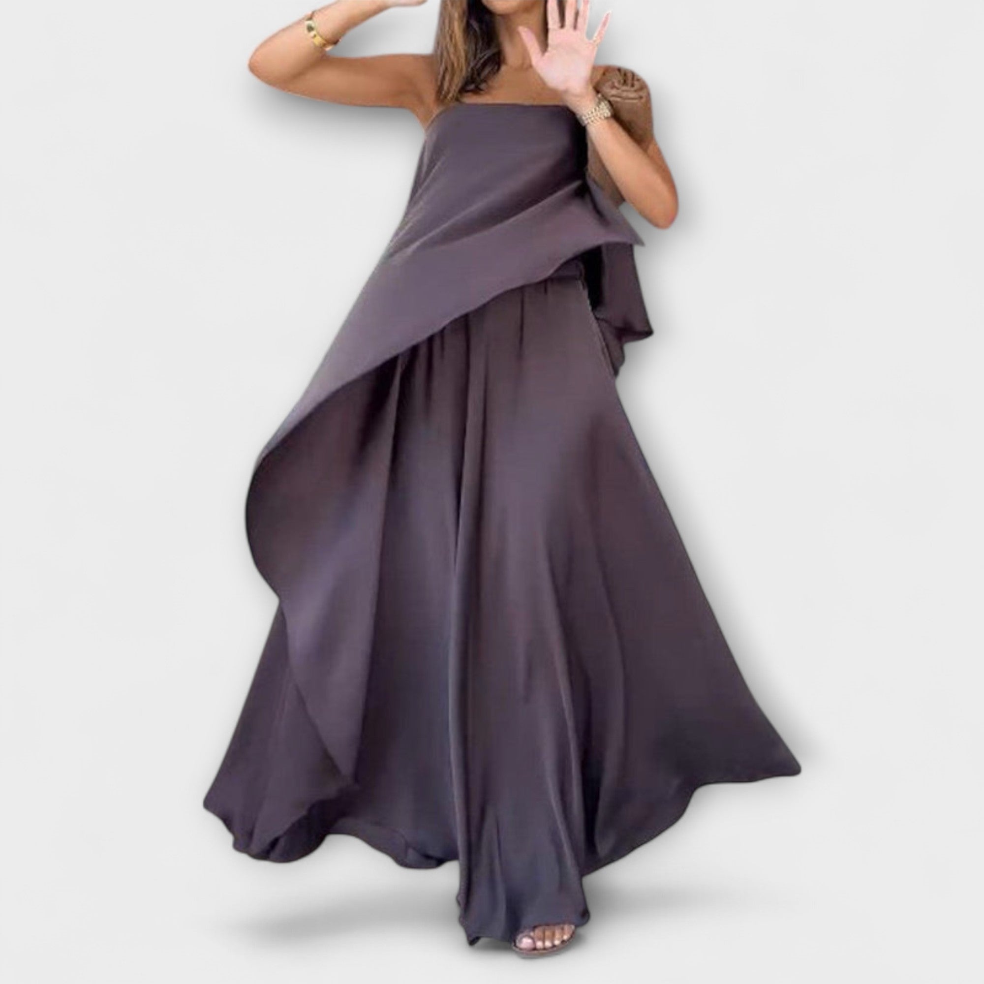 Strapless dark plum layered maxi dress with asymmetrical drape and full skirt