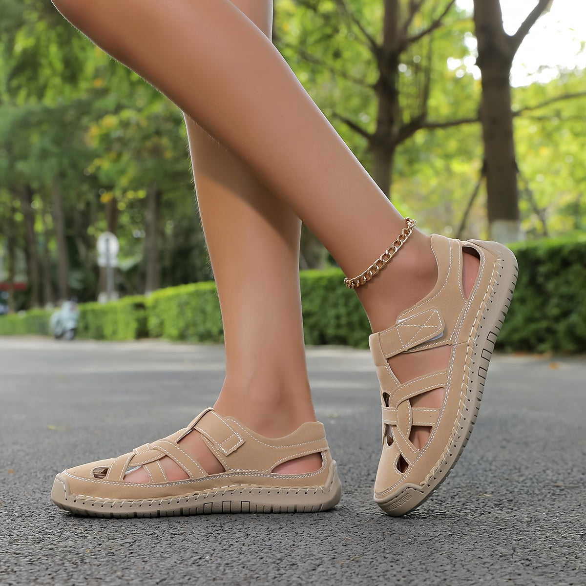 Lightweight summer sandals in khaki/beige on feet with ankle chain detail