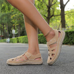 Lightweight summer sandals in khaki/beige on feet with ankle chain detail