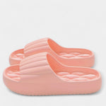 All-season slippers, coral pink molded slip-on slides with textured footbed and wide strap