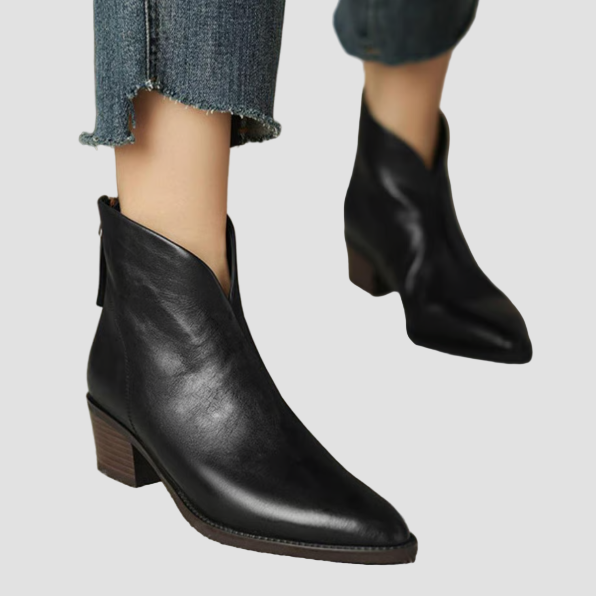 Black leather ankle boots with low block heel and pointed toe