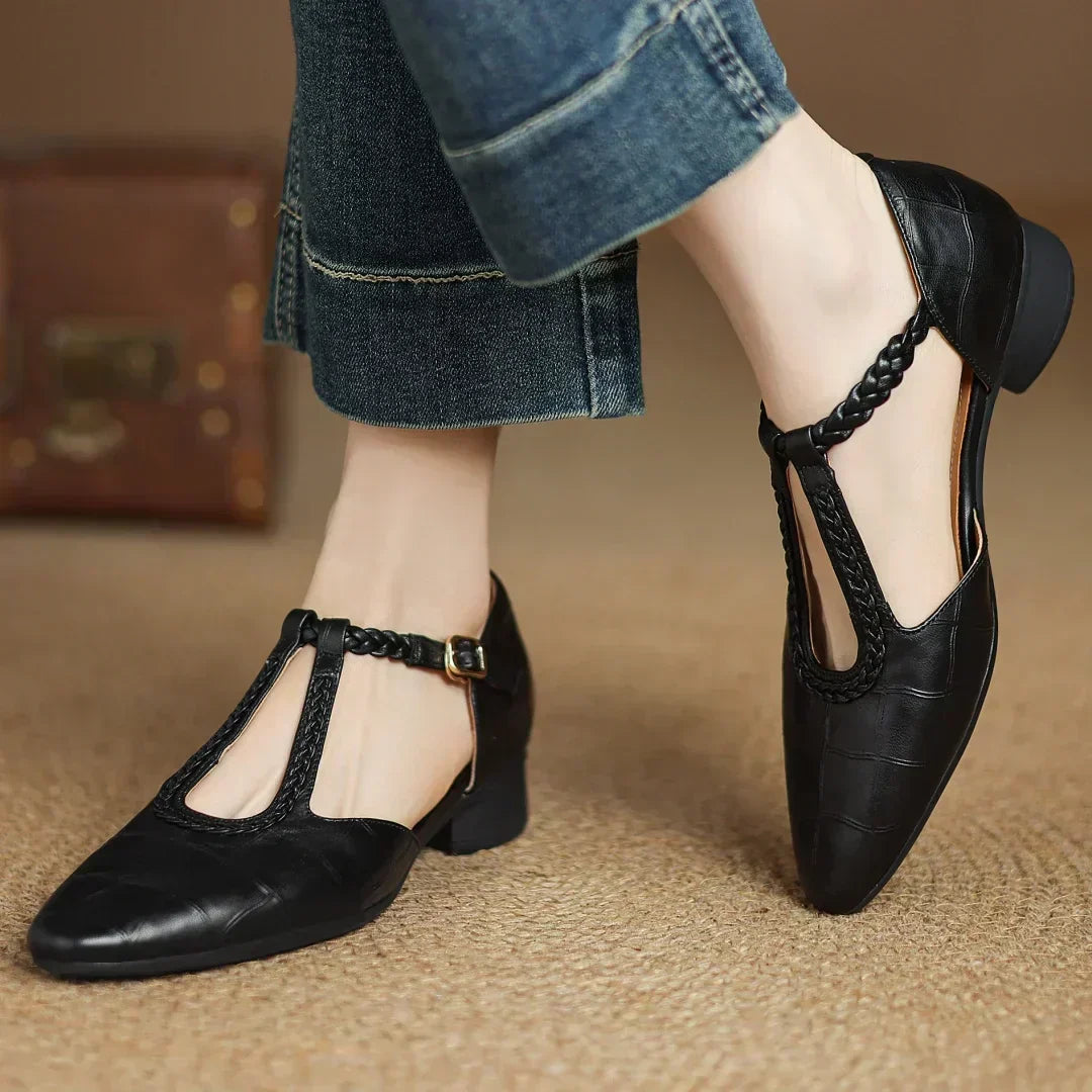 Black leather pointed-toe flats with braided T-strap and low block heel