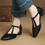 Black leather pointed-toe flats with braided T-strap and low block heel