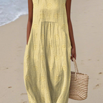 Yellow midi embroidered sleeveless dress with round neck and ruffled tiers
