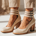Cream leather heeled ankle boots with two buckle straps and block heel