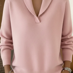 Pink V-neck knit sweater with long sleeves and ribbed cuffs and hem