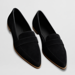 Black suede leather moccasin loafers with slip-on shape and contrast sole trim.