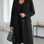 Women’s black long tailored coat with notched lapels, front buttons, and side pockets