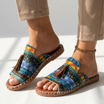 Platform slide sandals with bright multicolor patterned fabric straps, open toe, tassel detail