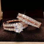 Rose gold ring set with round center stone and pavé bands