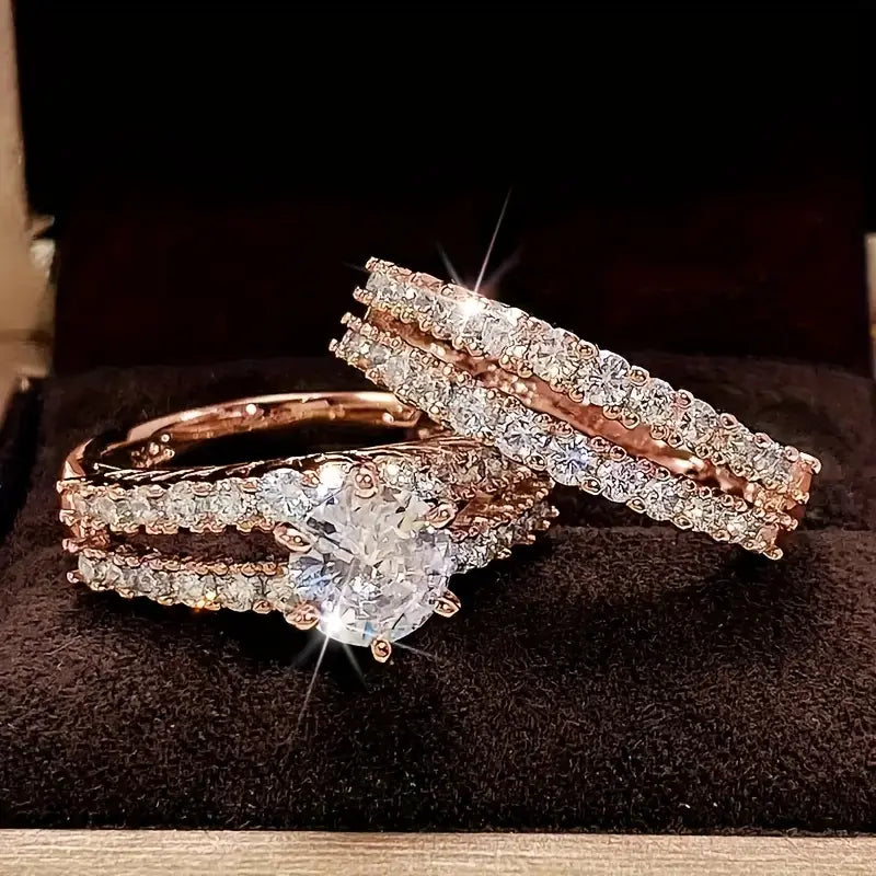 Rose gold ring set with round center stone and pavé bands