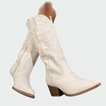 Cream suede mid-calf western boots with decorative stitched embroidery and block heel
