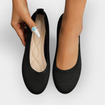 Black knit slip-on ballet flats with rounded toe and cushioned insole