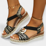 Roman knit sandals, black woven straps with espadrille wedge sole