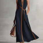 Elira linen dress in dark navy, V-neck, diagonal tan tie accents, sleeveless maxi