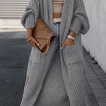 Light gray long cardigan with textured knit, open front, and roomy side pockets