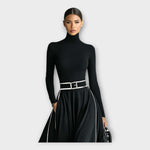 Black high-neck long-sleeve maxi dress with silver-buckle belt and contrast piping