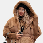 Tan quilted hooded jacket with patchwork design, front buttons, and ribbed cuffs