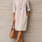 Cream midi shift dress with 3/4 sleeves and round neckline
