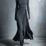 Maxi silk dress with long sleeves, draped side knot at waist, flowing dark skirt