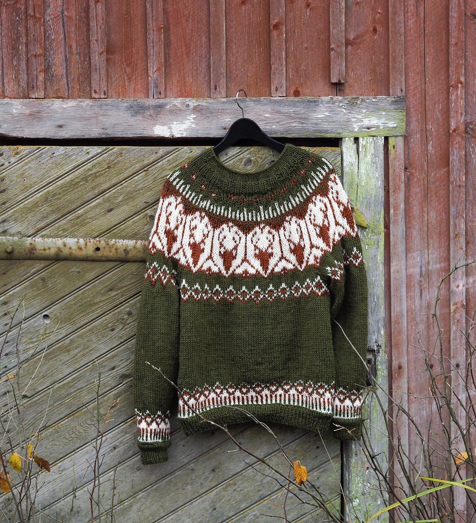 Olive green Fair Isle sweater with white and red geometric yoke, crew neck