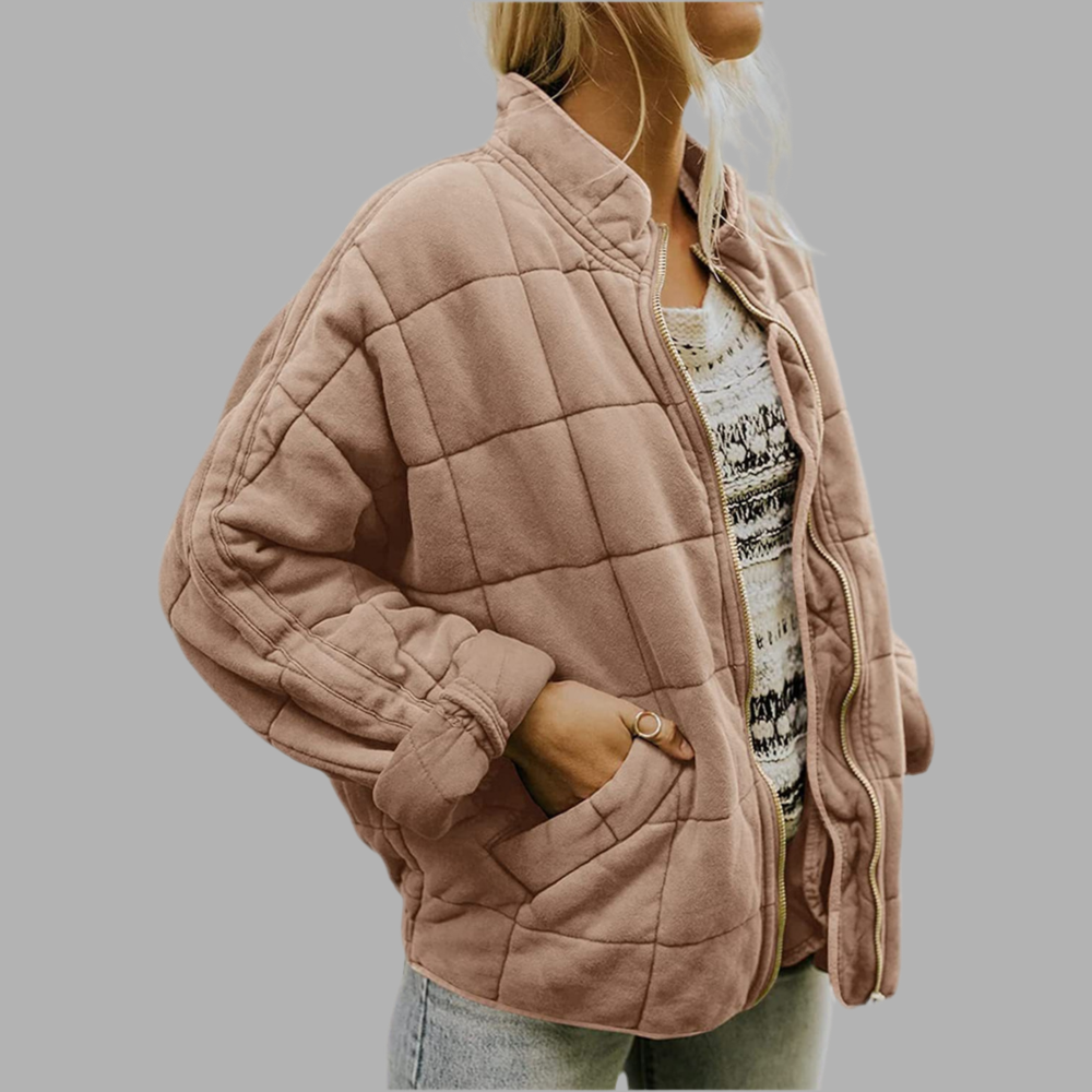 Light brown quilted puffer jacket with zip front, stand collar, and side pockets