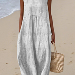 White midi embroidered sleeveless dress with round neck and ruffled tiers