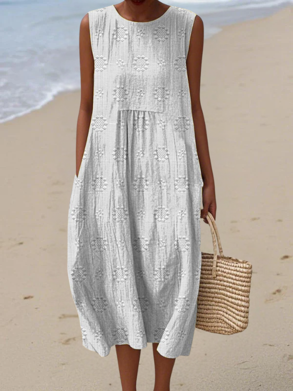 White midi embroidered sleeveless dress with round neck and ruffled tiers