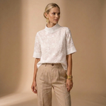 Women's white floral short-sleeve blouse with high neckline, smooth front