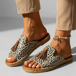 Platform slide sandals with leopard-print fabric upper, tan cork sole, tassel detail