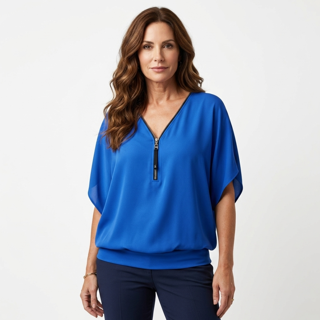 Blue zip-front blouse with short sleeves and V-neck placket