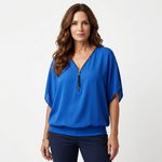 Blue zip-front blouse with short sleeves and V-neck placket