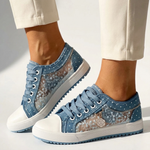 Light blue floral-pattern low-top sport sneakers, lace-up with white rubber toe